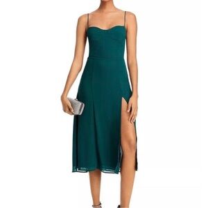 Green Bloomingdale’s midi dress with slit at bottom